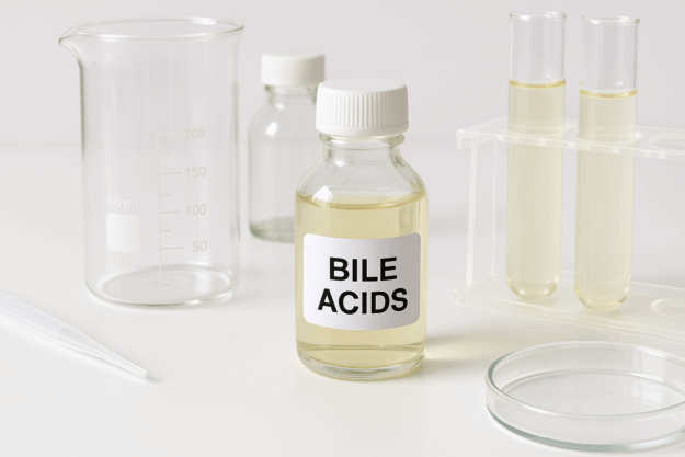 Bile acids research in modern life sciences laboratory Laboratory glass bottle with bile acids and test tubes for scientific research
